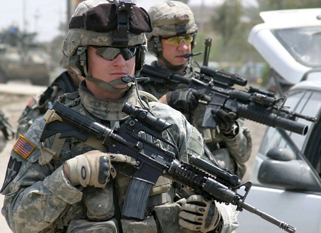 U.S. soldiers patrol a road in Diwaniya, 180km (112 miles) south of Baghdad April 15, 2007. REUTERS/Imad al-Khozai (IRAQ)