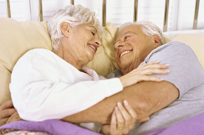 Senior-couple-lying-on-the-bed