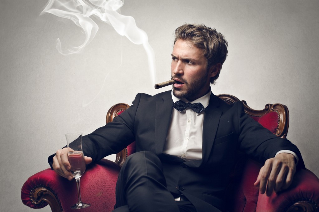 Bearded-man-sitting-with-cigar-and-champagne-1024x682