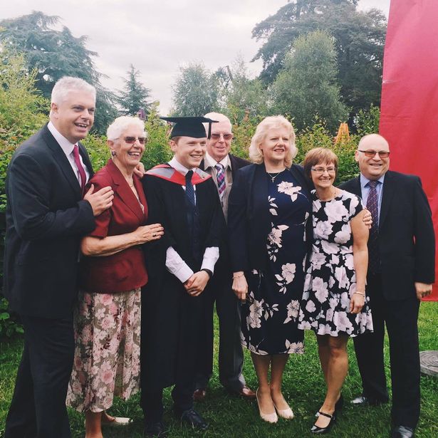 PAY-Andy-Evans-pictured-on-his-graduation-day-with-his-mum-Jane-third-right-and-dad-David-far-right