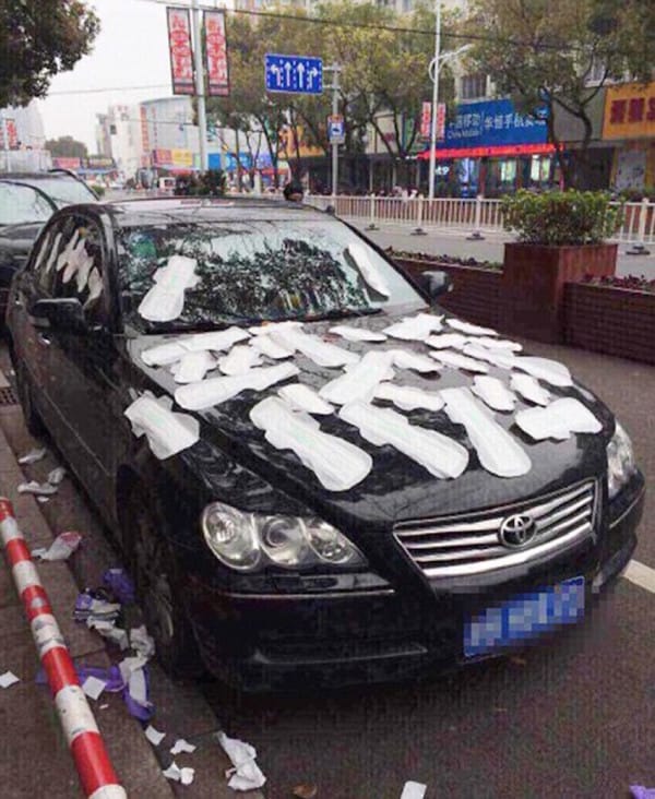 Pic shows: The car was covered in sanitary towels. A man who stayed at a friendís house to plan a surprise birthday party for his girlfriend had the shock of his life when he got home and found she had covered his car in sanitary towels - because she thought he was having an affair. Green-eyed Li Tan, 23, was convinced boyfriend De Wu, 24, was cheating on her in Dancheng Township in eastern Chinaís Zhejiang province. So when he did not come home that night she went to her local shops, bought 30 pads and stuck them all over the car he was renting as stunned passers-by watched on. Li's pal Chung Chen, 24, said: "She was furious, and I told her she should wait to see what he said before she attacked the car, as it wasnít even his. "But she wouldnít listen as she was convinced he was cheating on her and so I let her get on with it. "It made her feel better." Fuming Li then went online and using the nickname "Unkind" posted photos of the mess alongside the caption: "Thatís right, I did it!!" She was quickly swamped with messages of support from online viewers. One, Xia Lo posted: "Great move! Thatíll teach him." Another, Tao Fang wrote: "Hahaha, go for it, girl." And Yu Feng said: "You should have done it with used ones." When bewildered boyfriend De got back home the following day he was shocked at what he saw. He said: "I asked her what had happened and she flew into a rage. "I explained what I had been arranging her surprise party for and showed her the reservation I had made online for a fancy restaurant I was going to take her to. "I then told her her that all her friends were going to turn up later. "She eventually believed me and we sorted things out, but I donít think anyone will want to rent that car anytime soon." (ends)