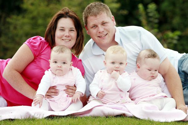 ***EXCLUSIVE*** NORTHAM, UNITED KINGDOM, UNDATED: Hannah Karsey, 23, and partner Mick Faulkner, 23, seen with their triplet girls Ruby, Tilly and Gracie in Northam, England. Hannah Kersey, 23, made world medical history last year when she gave birth to triplets from two separate wombs. She was born with a rare condition known as uterus didelphys which meant she developed two wombs. She became pregnant with triplets; two of the babies developed on one of the wombs, whilst the third baby in the second. Hannah and her partner Mick Faulkner, 23, who together live in Northam, Devon, have successfully celebrated the birthday of their healthy triplet girls Ruby, Tilly and Gracie. PHOTOGRAPH BY Worldwide Features / Barcroft Media UK Office, London. T +44 845 370 2233 W www.barcroftmedia.com USA Office, New York City. T +1 212 796 2458 W www.barcroftusa.com Indian Office, Delhi. T +91 11 4053 2429 W www.barcroftindia.com